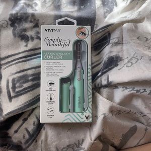 Heated eyelash curler